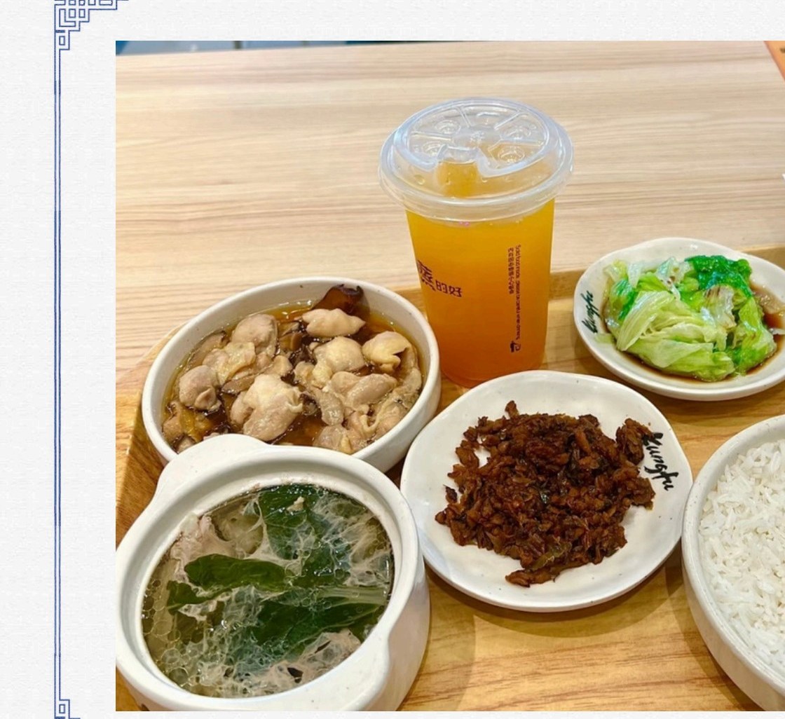 A Steam Street tray of steamed chicken, rice, greens and dim sum